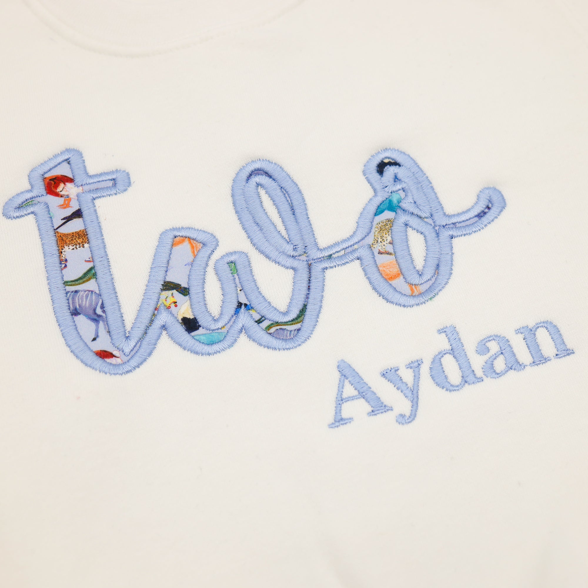 Embroidered fabric nameplate with 'Two Aydan' on a white background