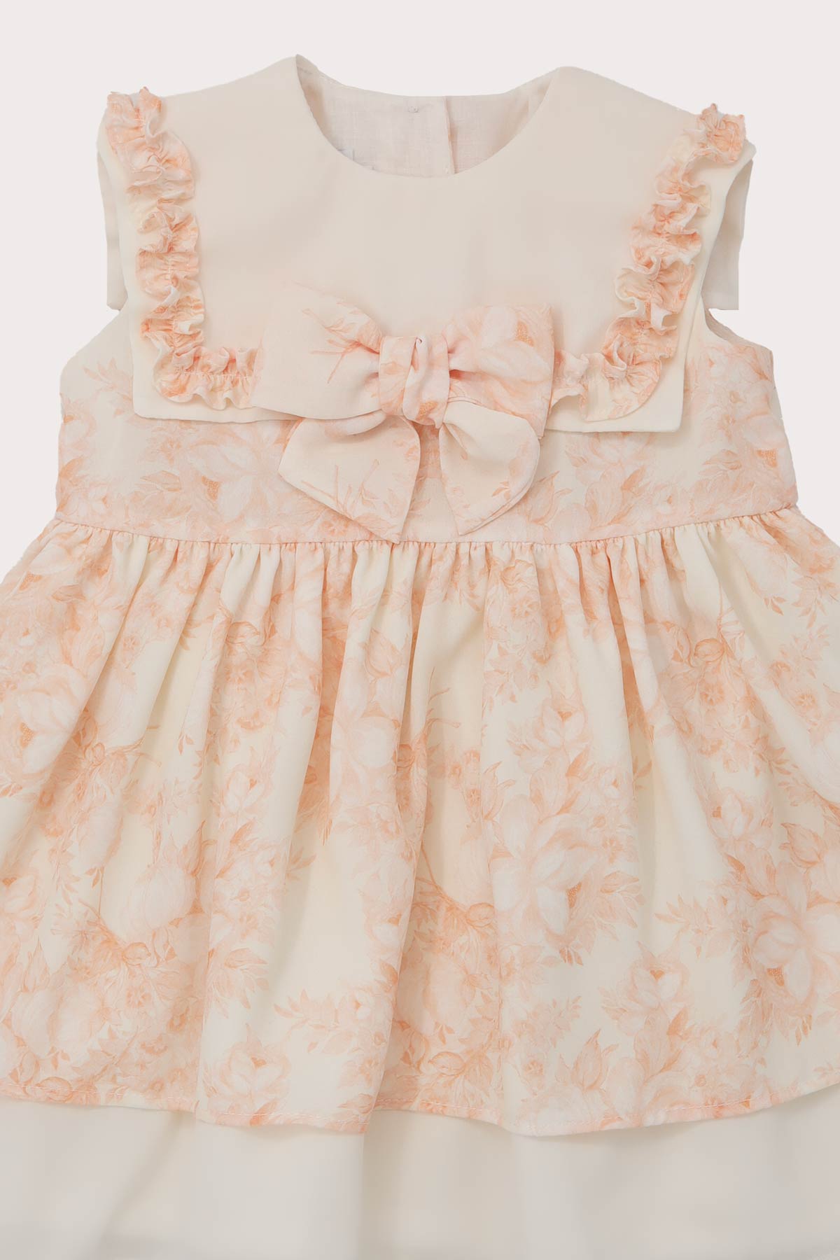 close up of ivory & peach chiffon girls romper