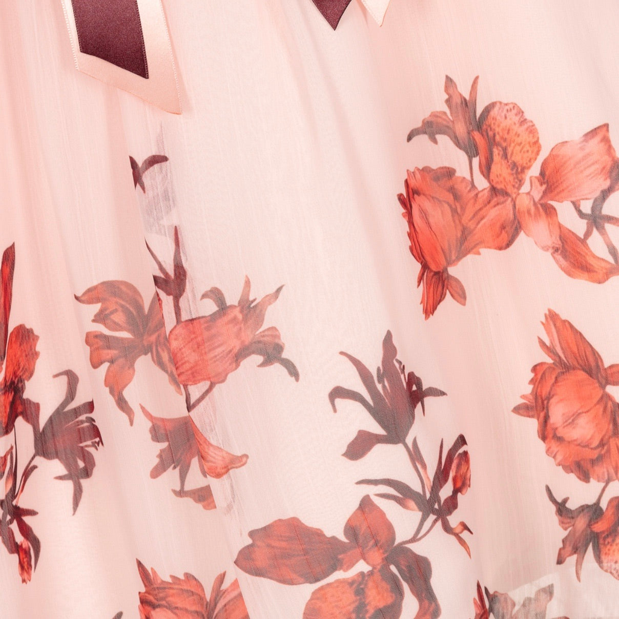 close up of floral print on patachou chiffon girls dress