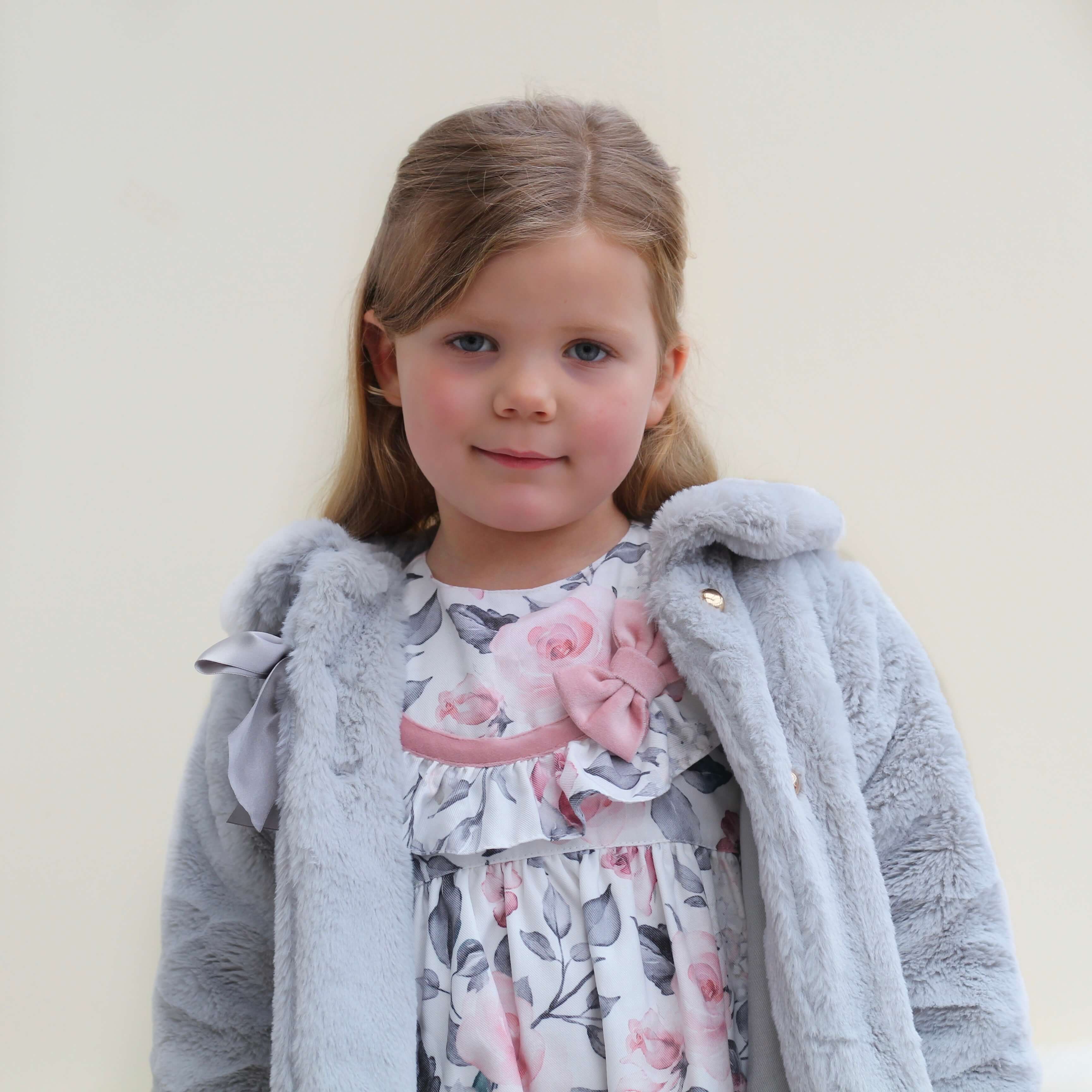 girl wearing grey faux fur coat