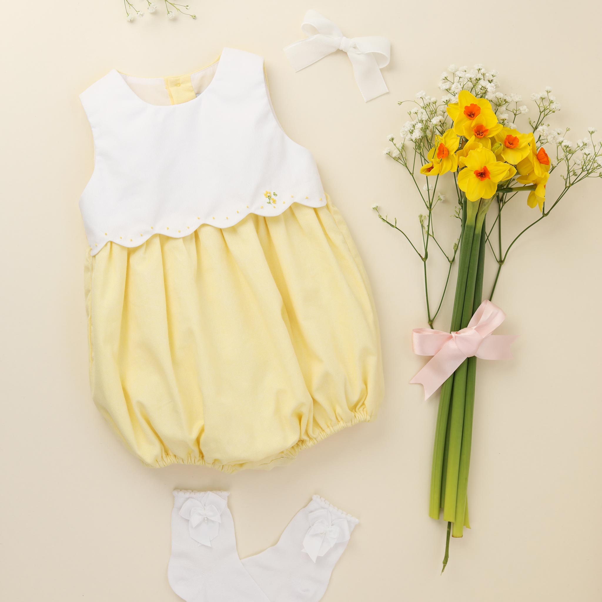 baby girl romper lemon flatlay
