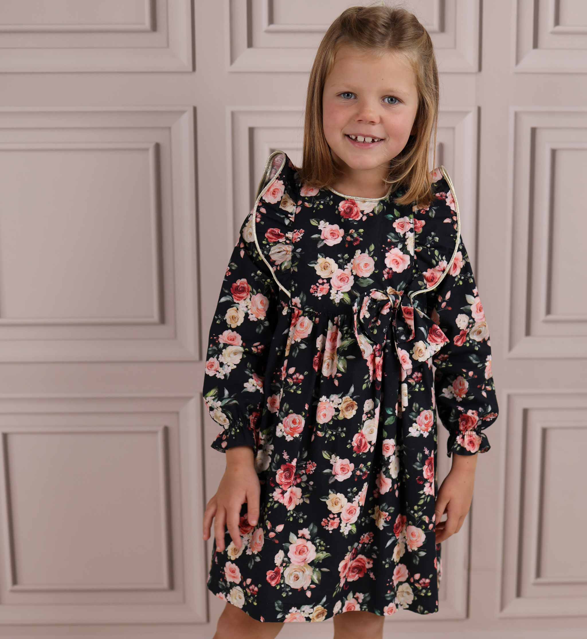 girl wearing black floral girls dress