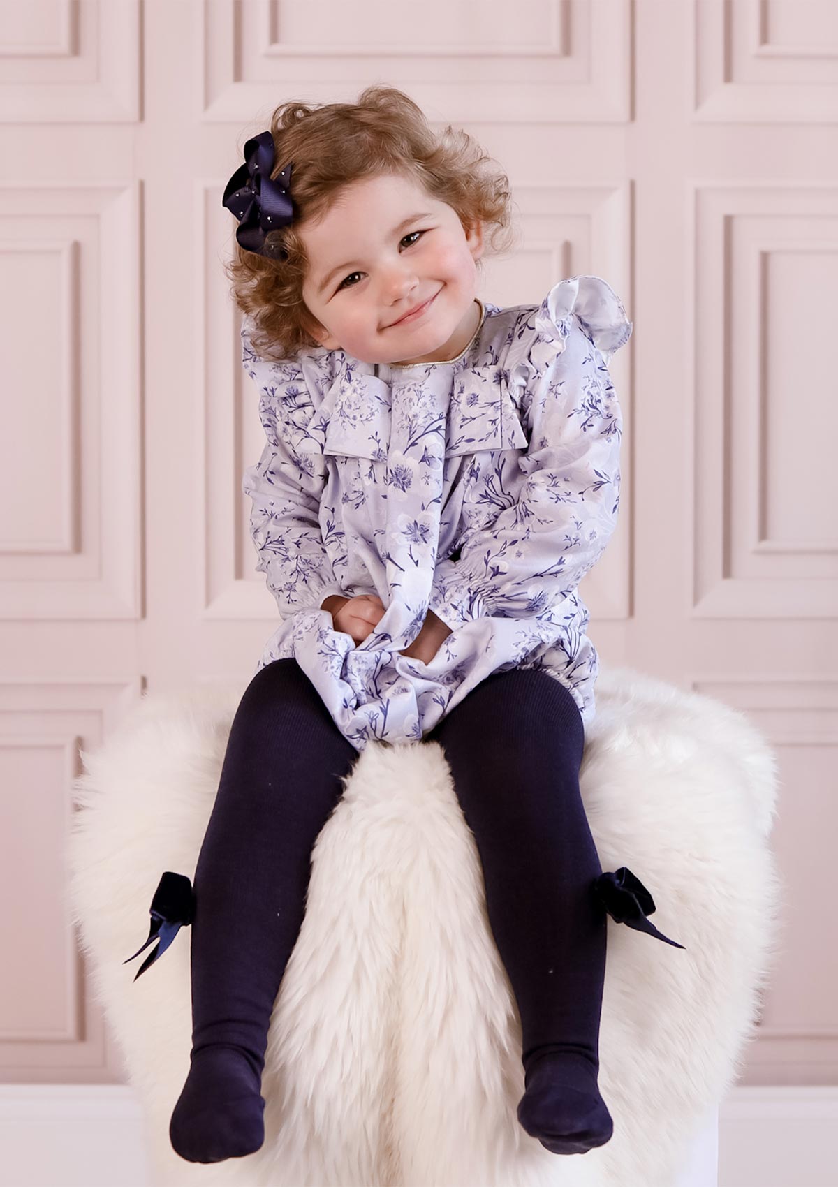 girl wearing blue floral girls romper