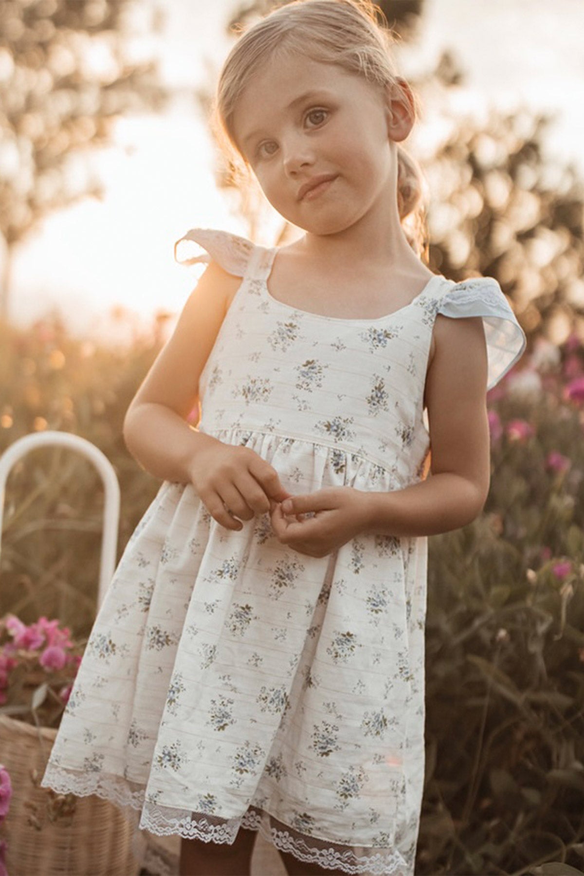 girl wearing blue flutter boho dress