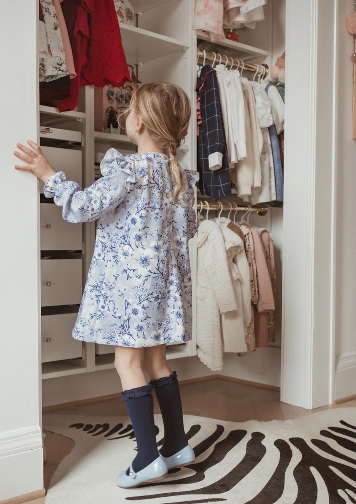 girl wearing blue floral dress