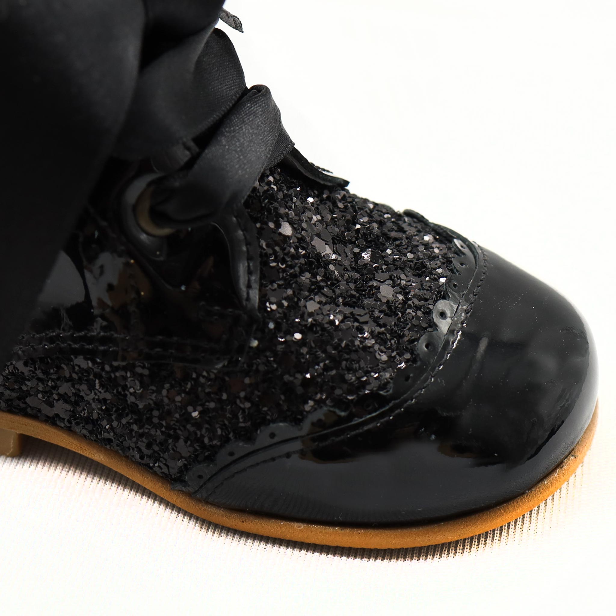 close up girls black leather boots
