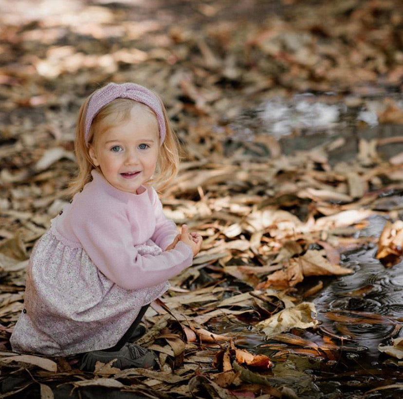 girl wearing wedoble half knit merino wool baby dress