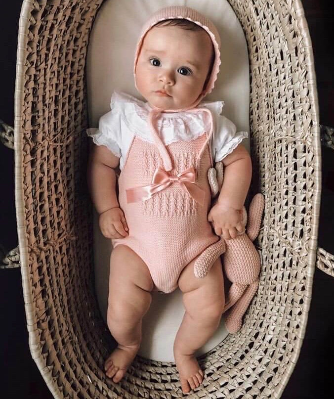 baby wearing ponk knitted baby romper