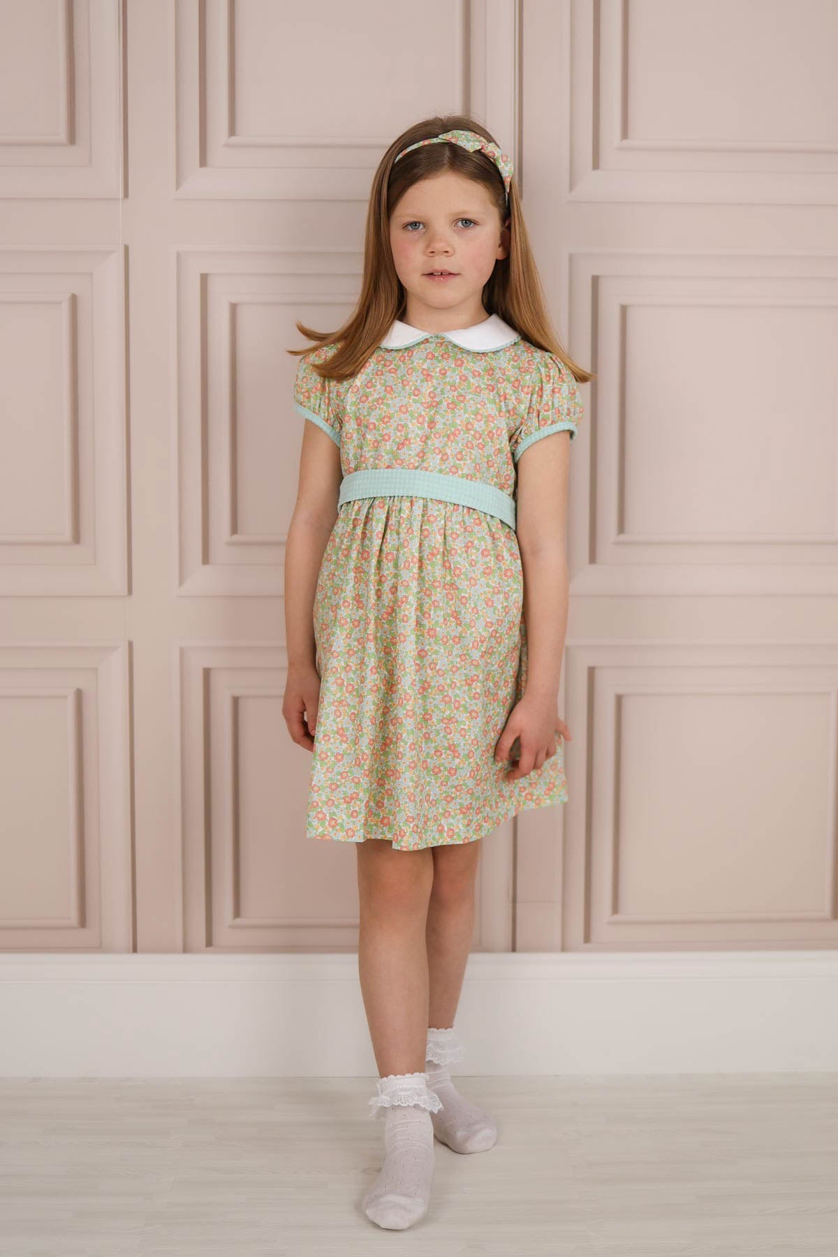 girl wearing floral classic dress