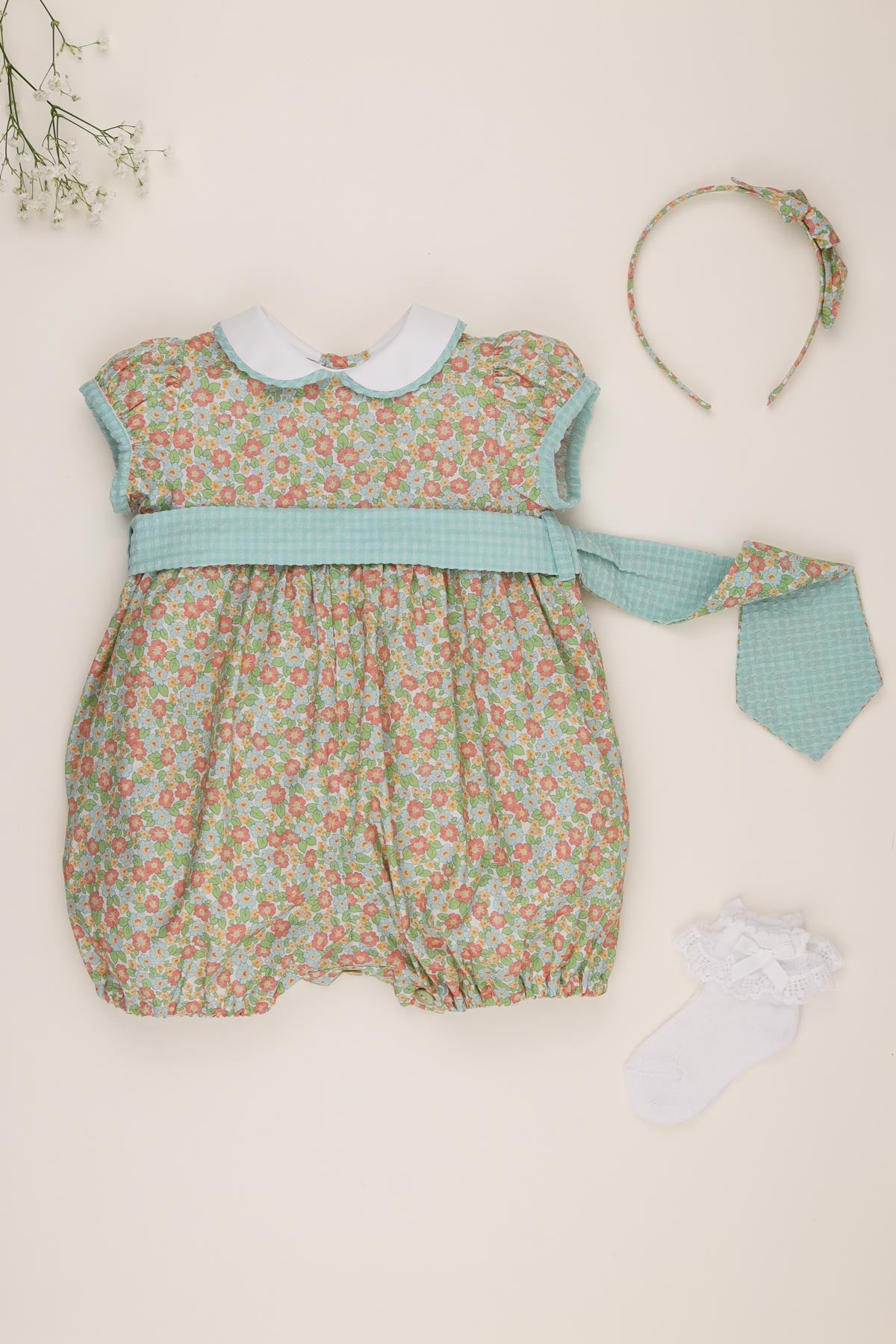 liberty print baby girl romper flatlay