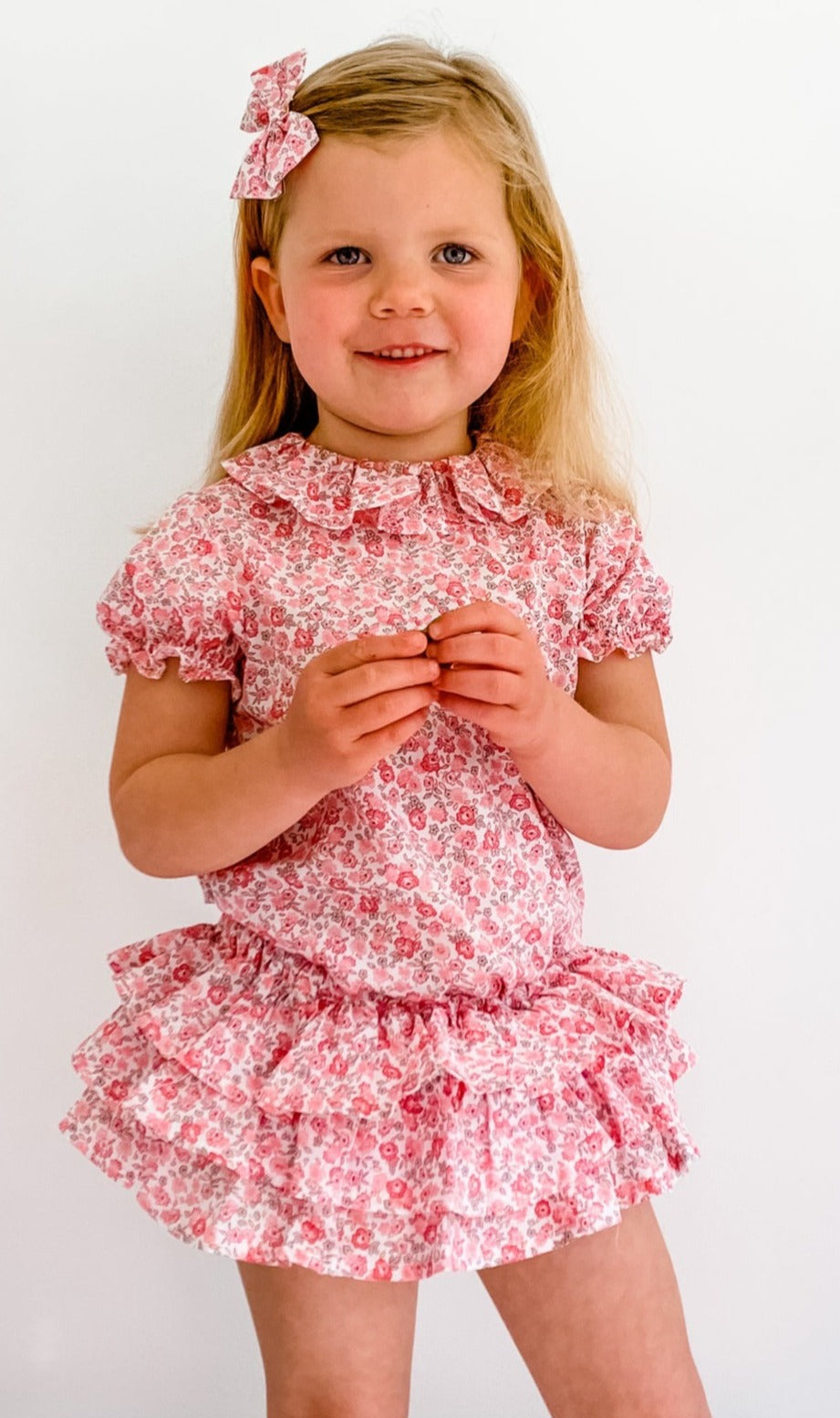 girl wearing spanish baby blouse & bloomer