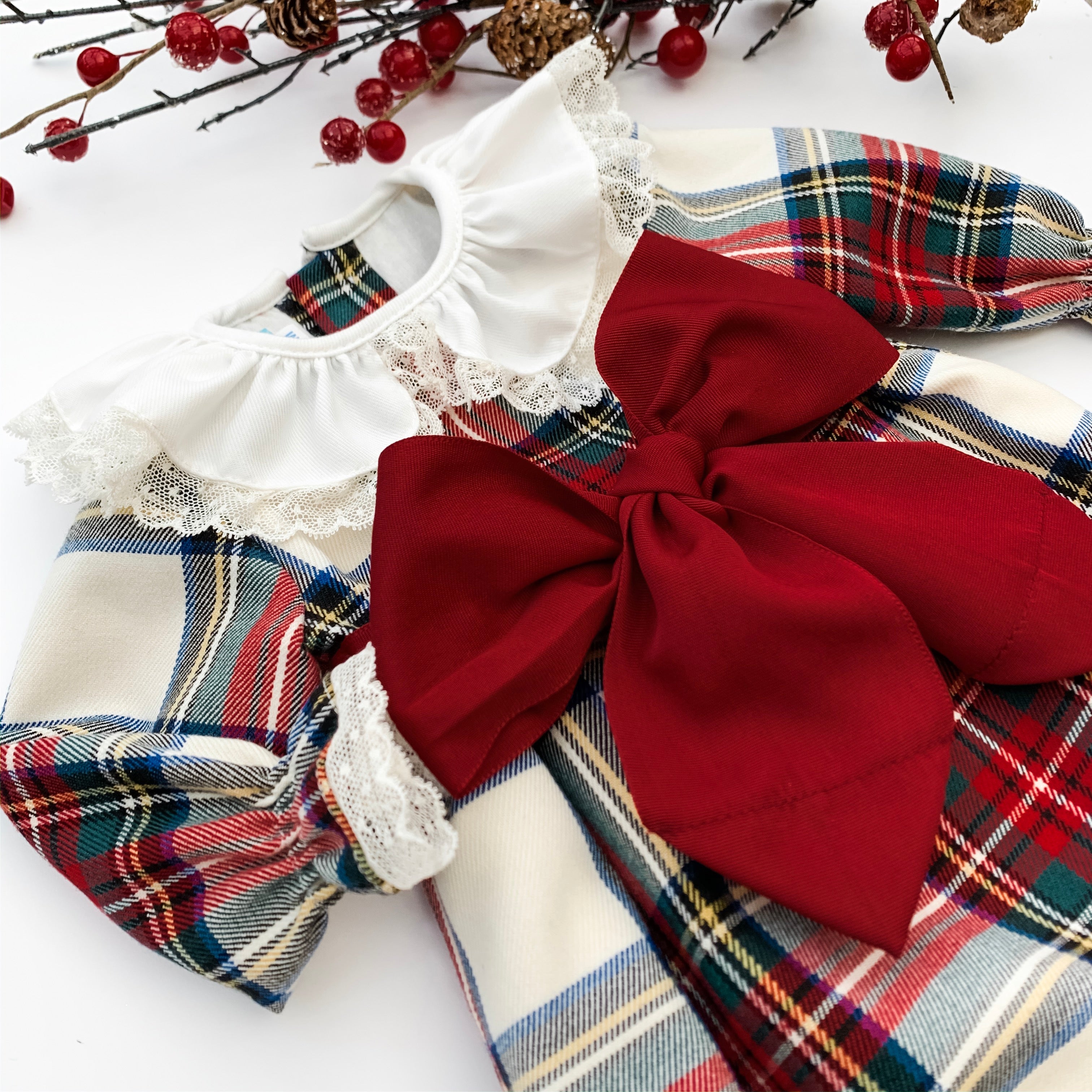 close up of tartan girls dress with burgundy sash, made in portugal