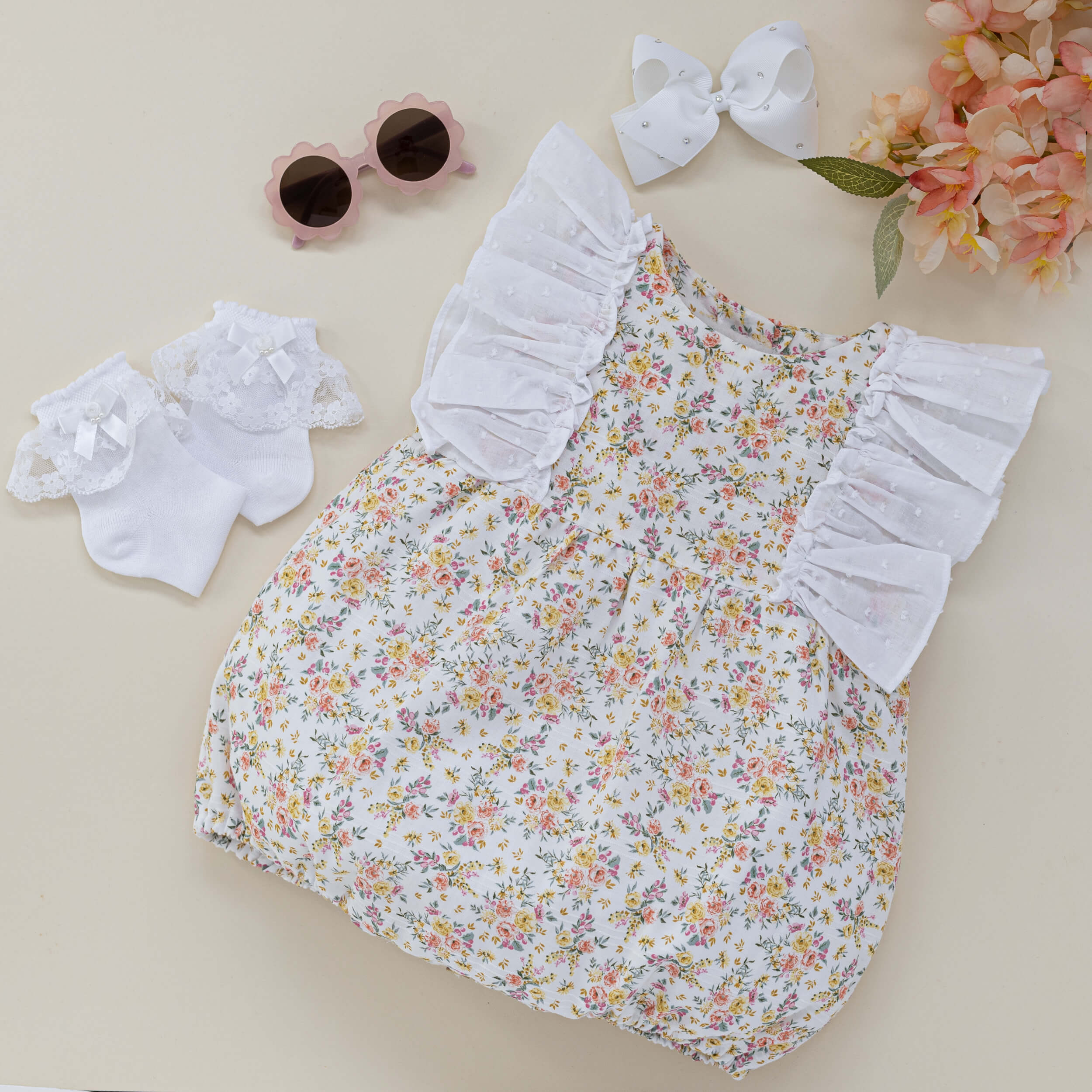 floral baby romper with plumeti frill
