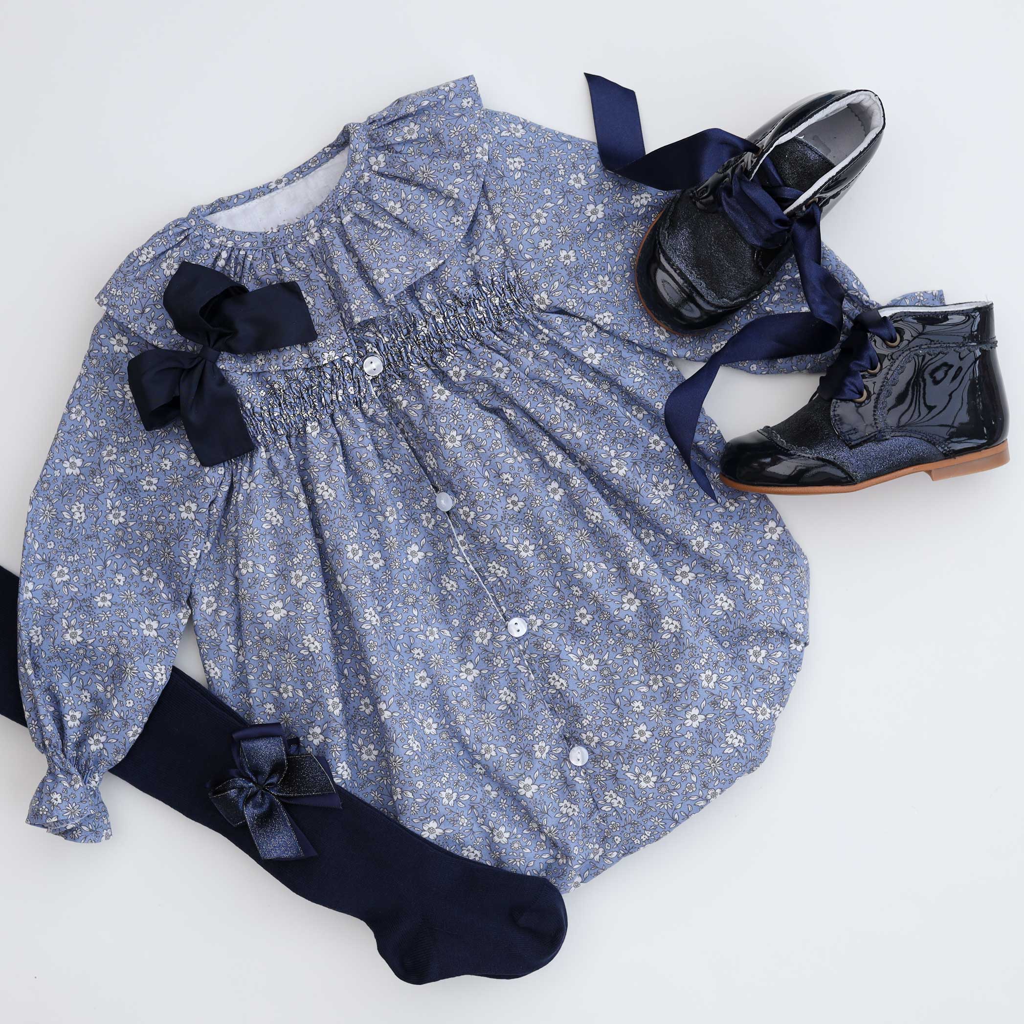 frill collar blue floral baby girl romper with tights & boots flatlay]