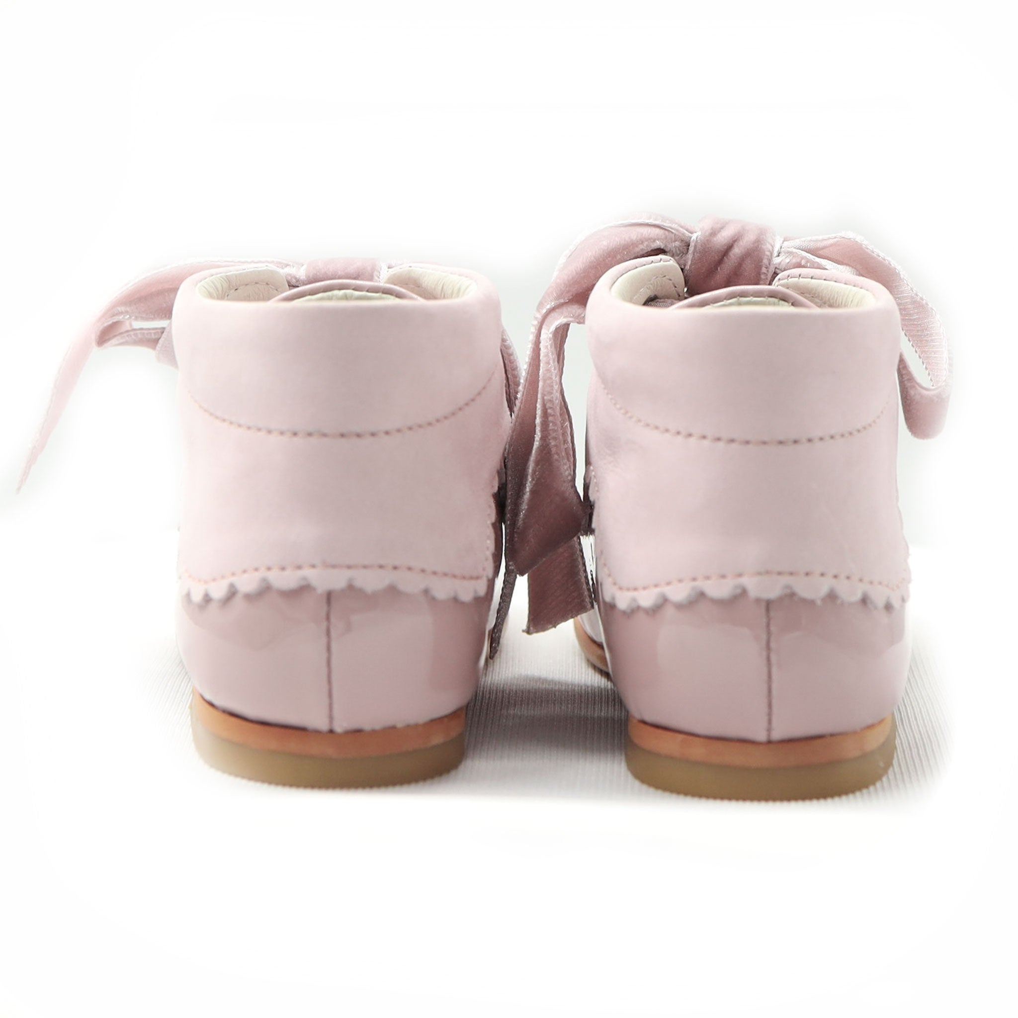 back of girls patent leather pink boots