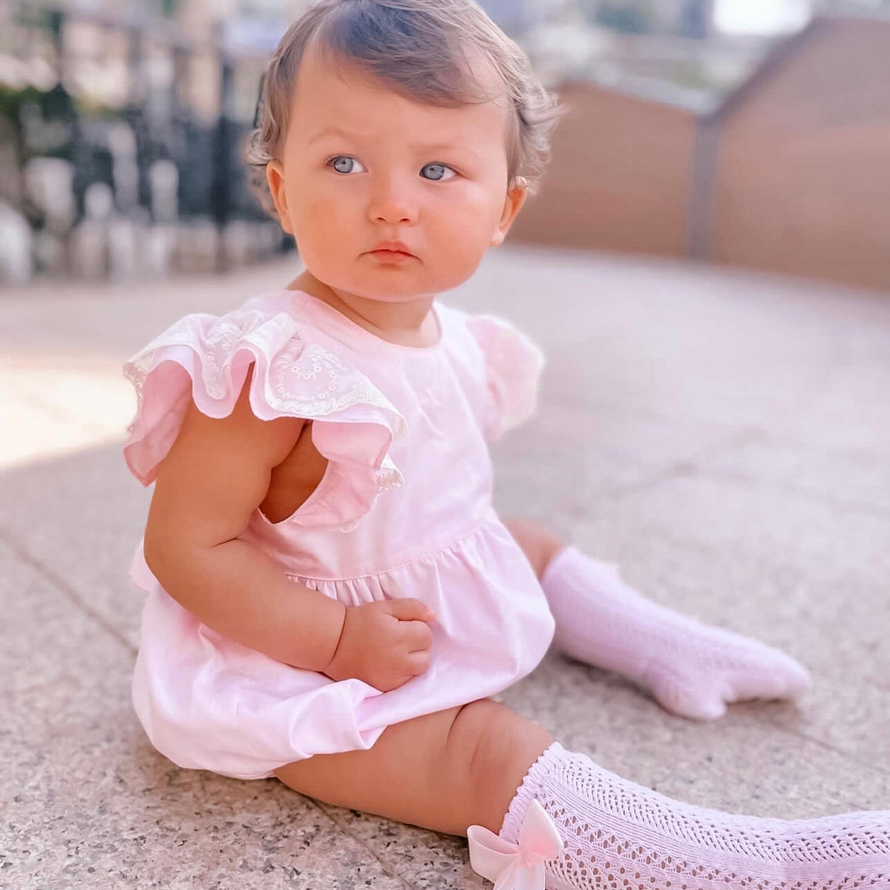baby girl wearing pink baby girl romper