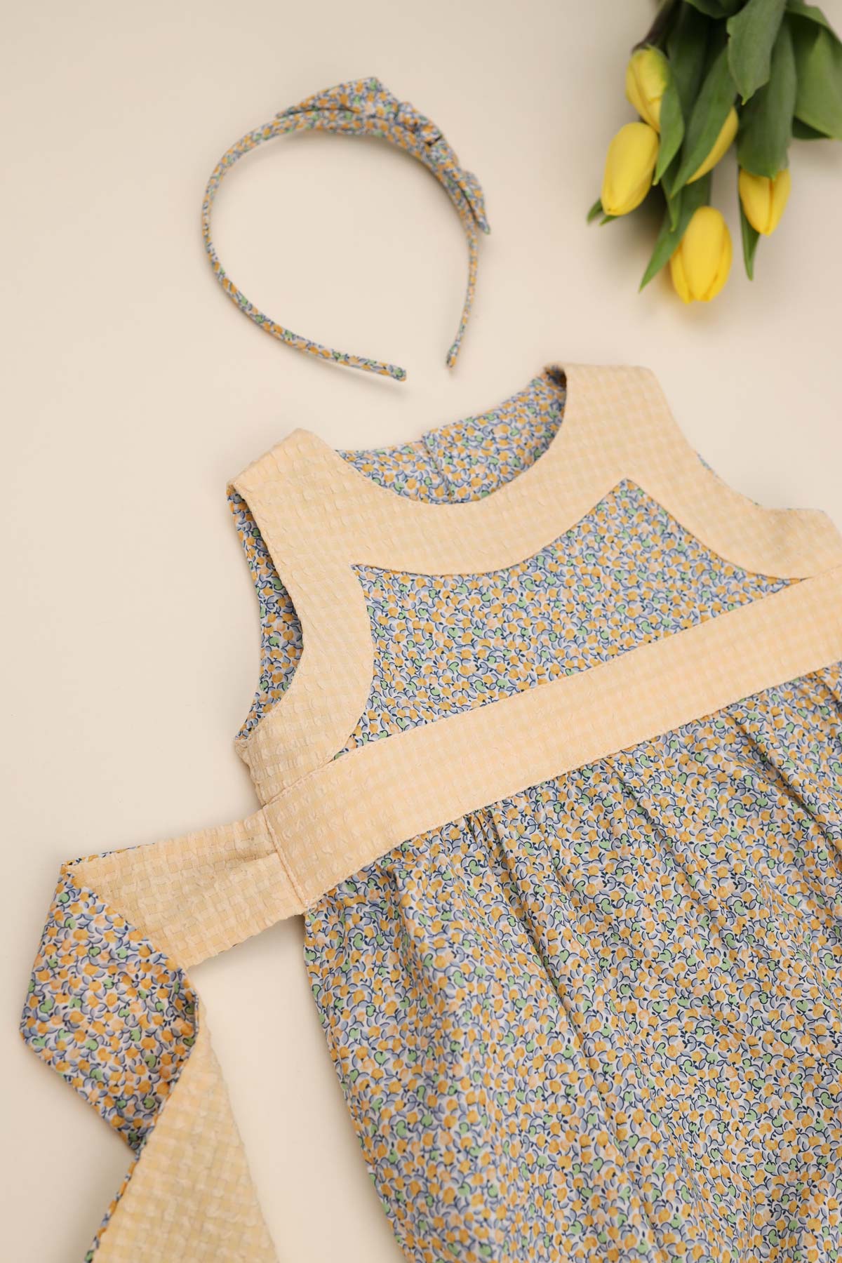 lemon ditsy print baby girl romper flatlay