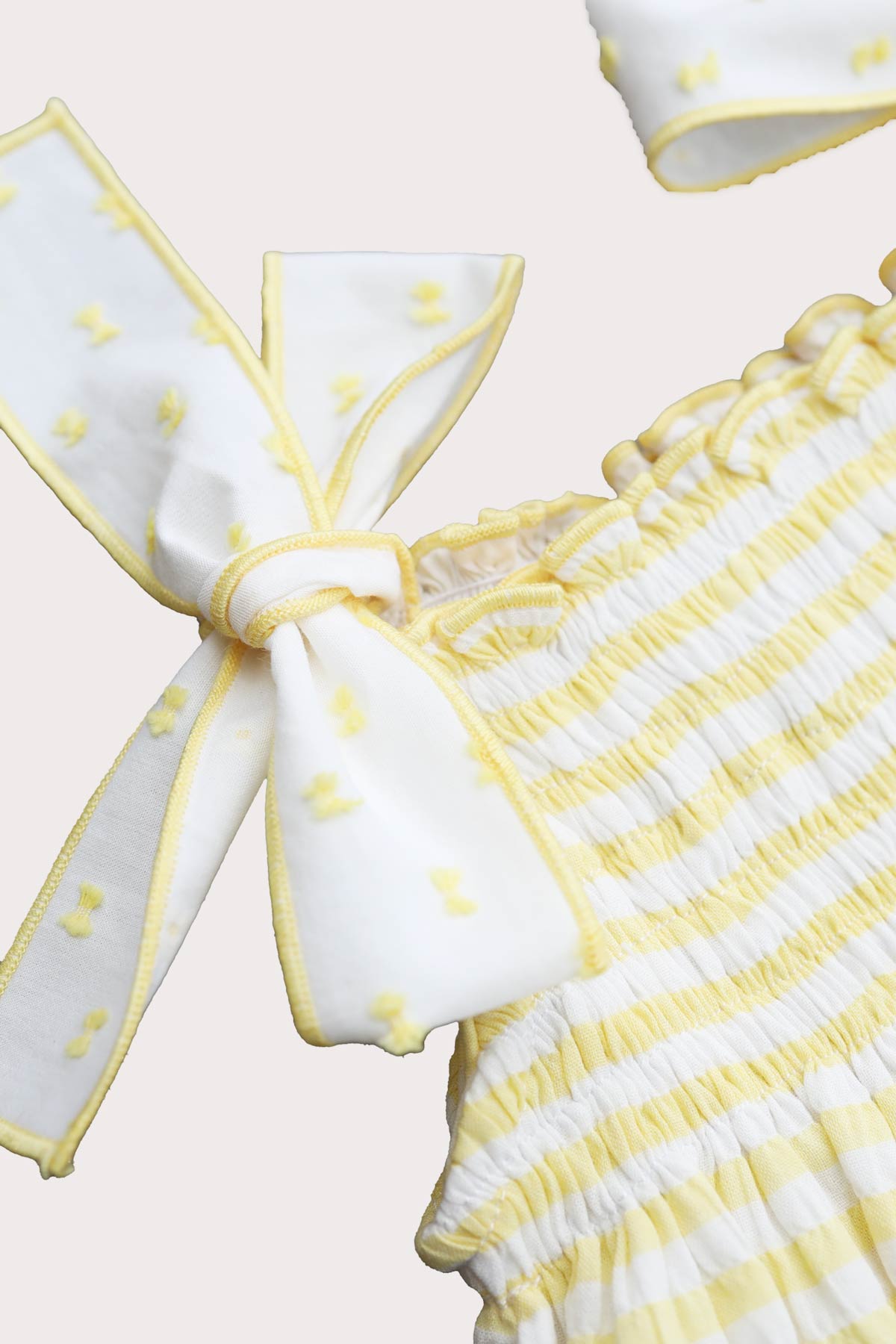 lemon striped baby girl romper with plumeti shoulders