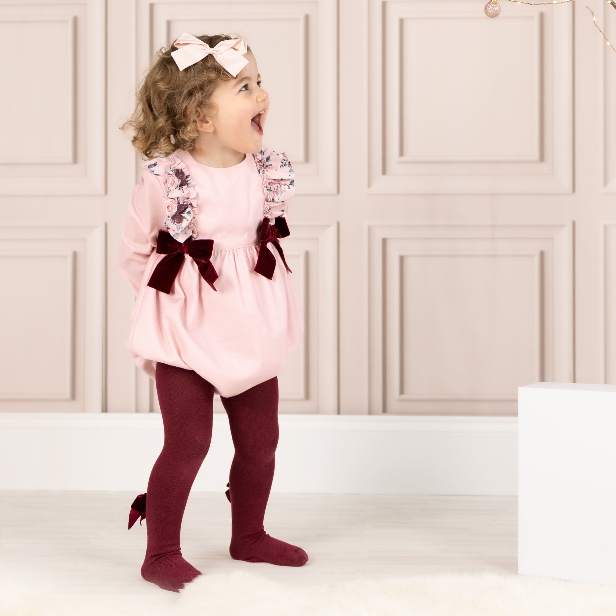 pink girls romper with burgundy tights