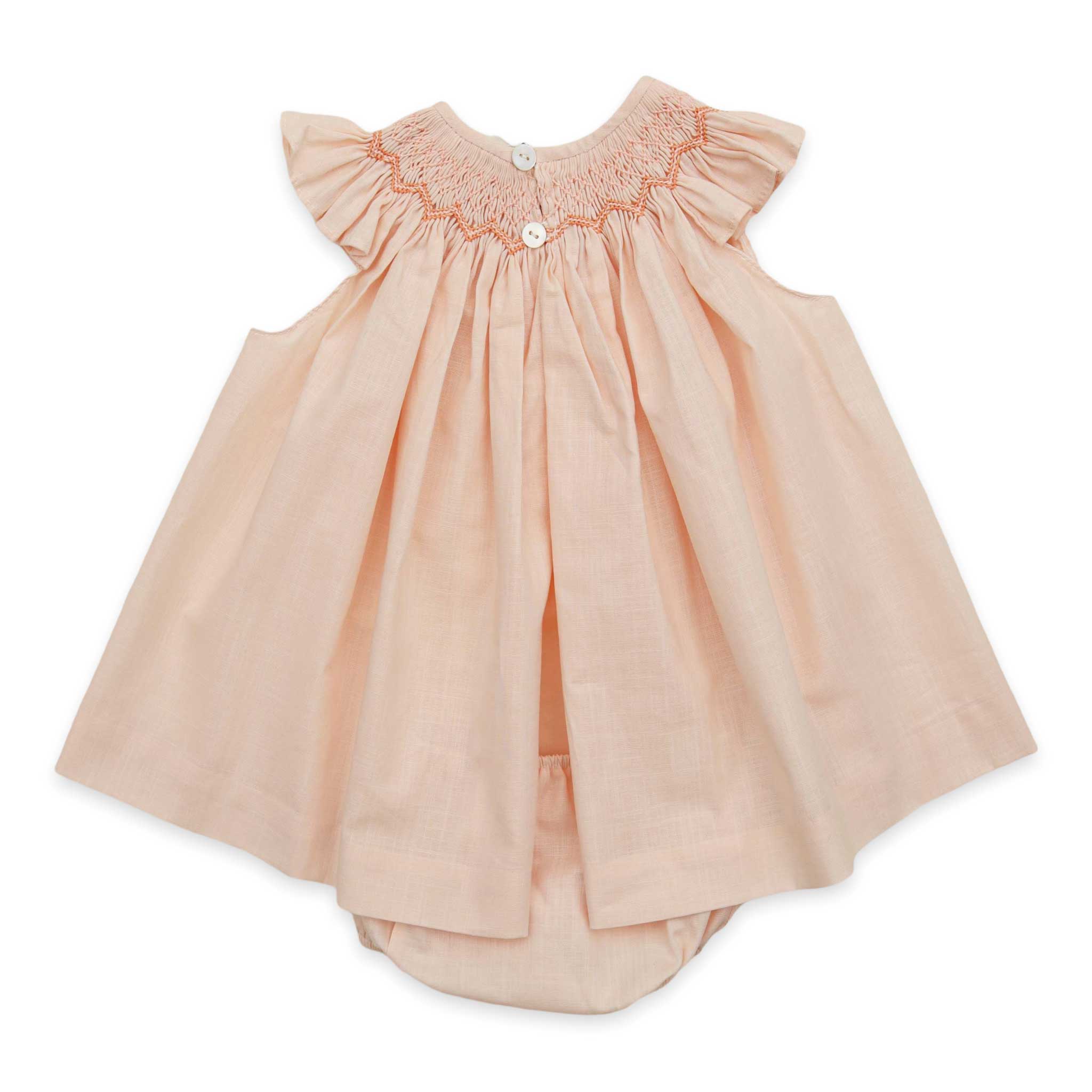 spanish hand smocked baby girl outfit in peach